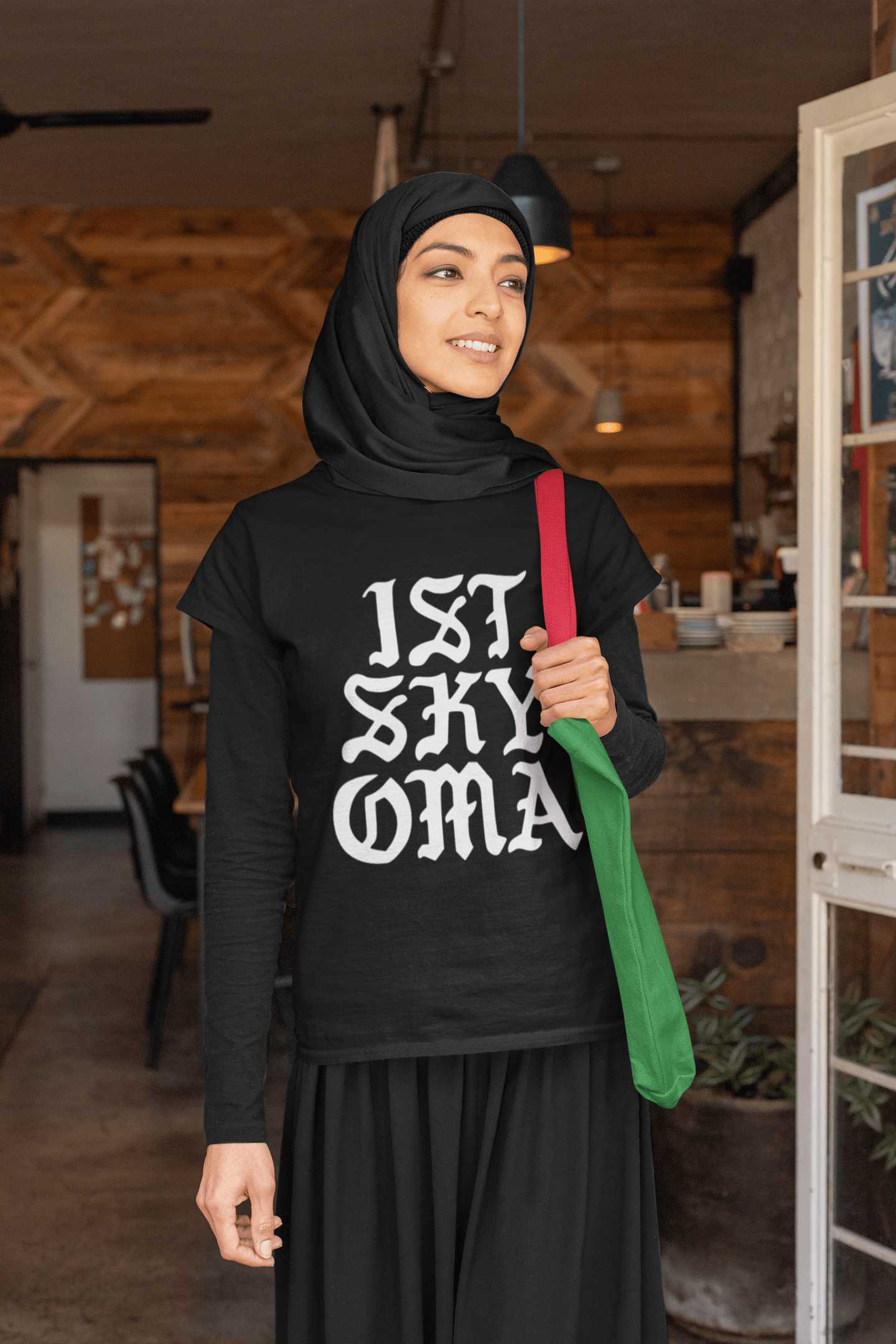 t-shirt-mockup-of-a-woman-with-a-hijab-holding-her-purse-32407