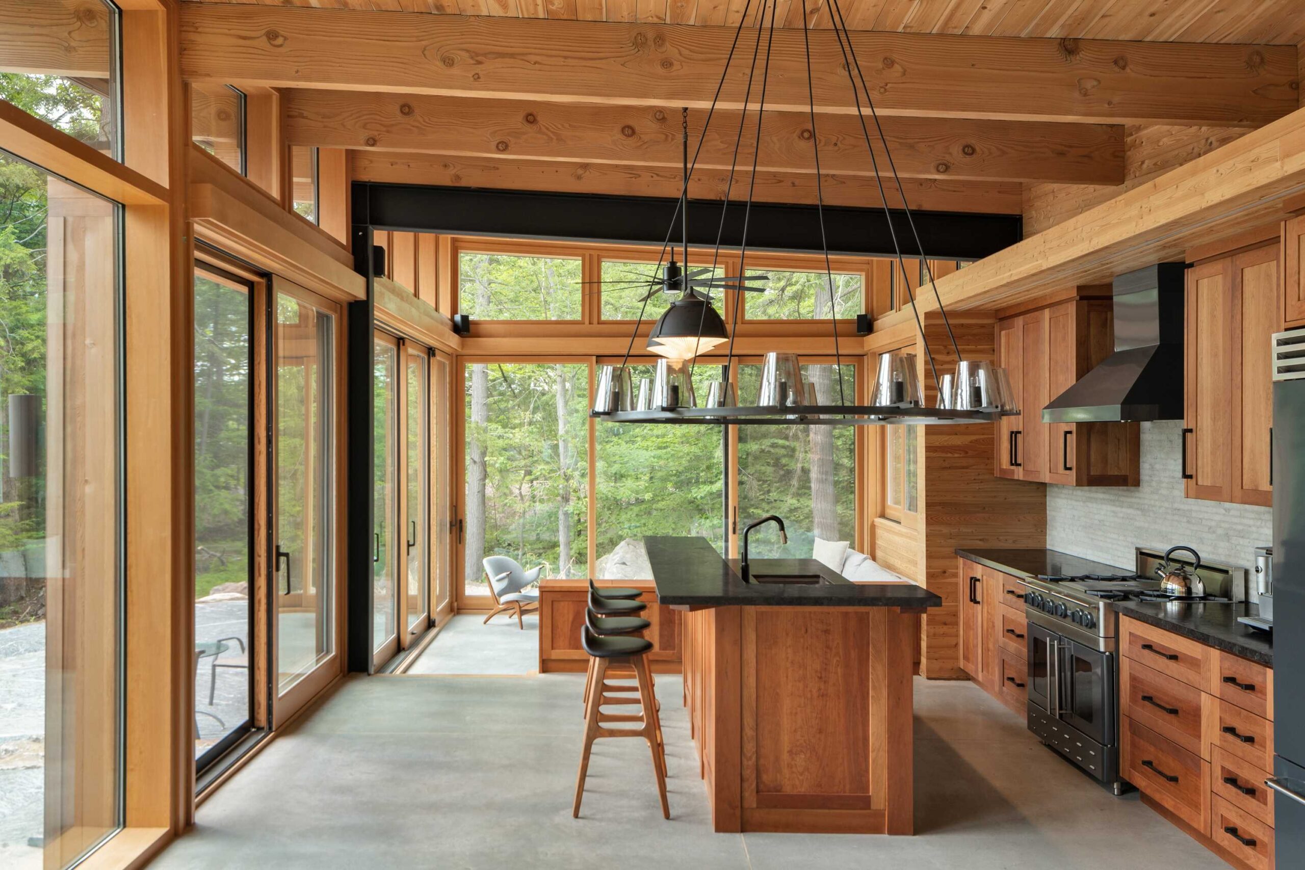 Modern kitchen with large windows and wooden elements