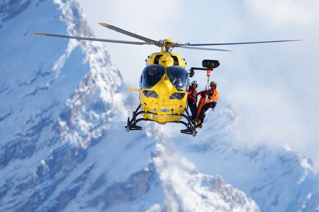 A rescue helicopter arrives after United States' Lindsey Vonn crashed during an alpine ski women's downhill race, at the 2026 Winter Olympics, in Cortina d'Ampezzo, Italy, Sunday, Feb. 8, 2026.
