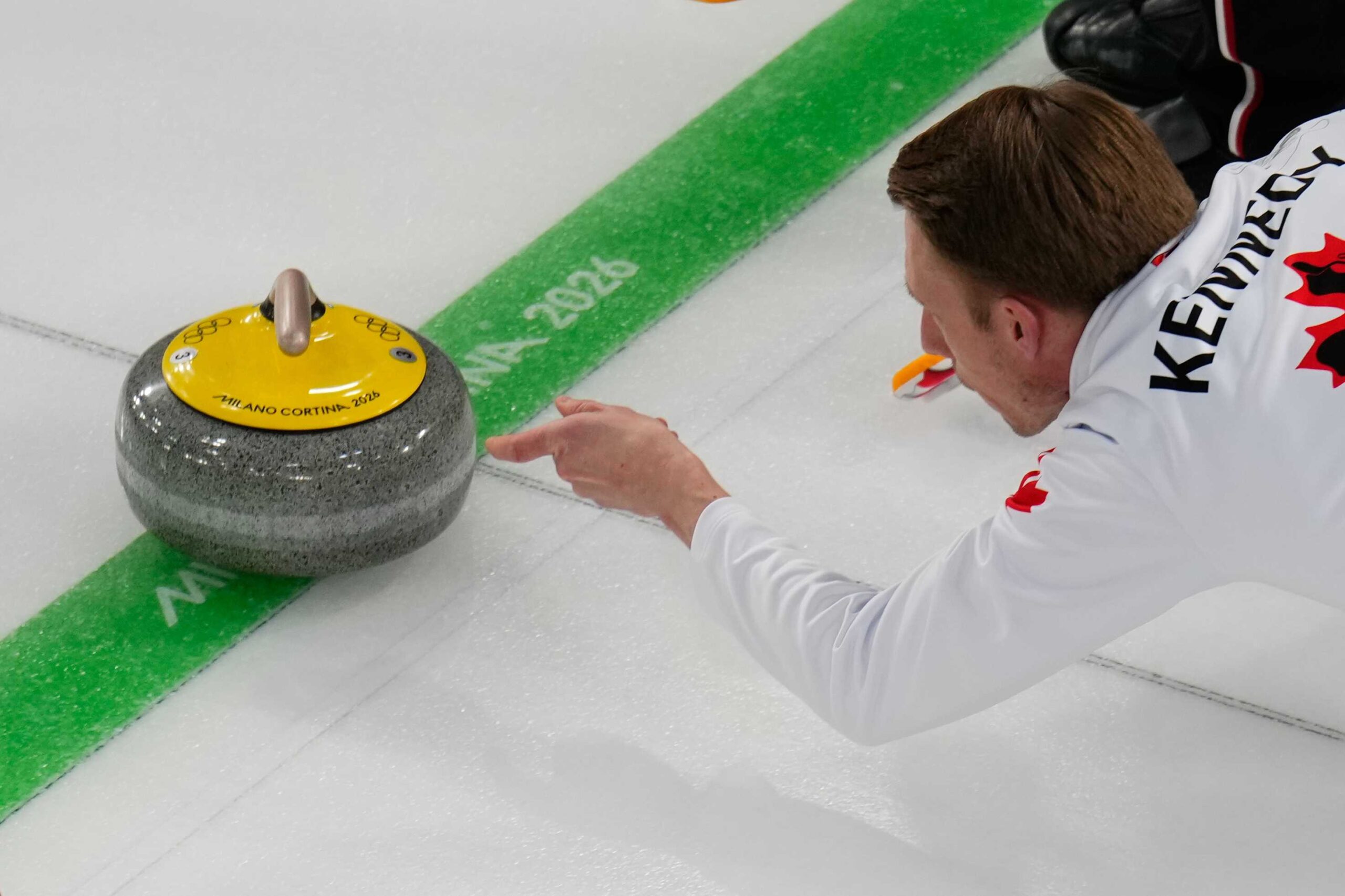 Canada's Marc Kennedy delivers the stone during a men's curling round robin match against China at the 2026 Winter Olympics, in Cortina, Italy, Sunday, Feb. 15, 2026.
