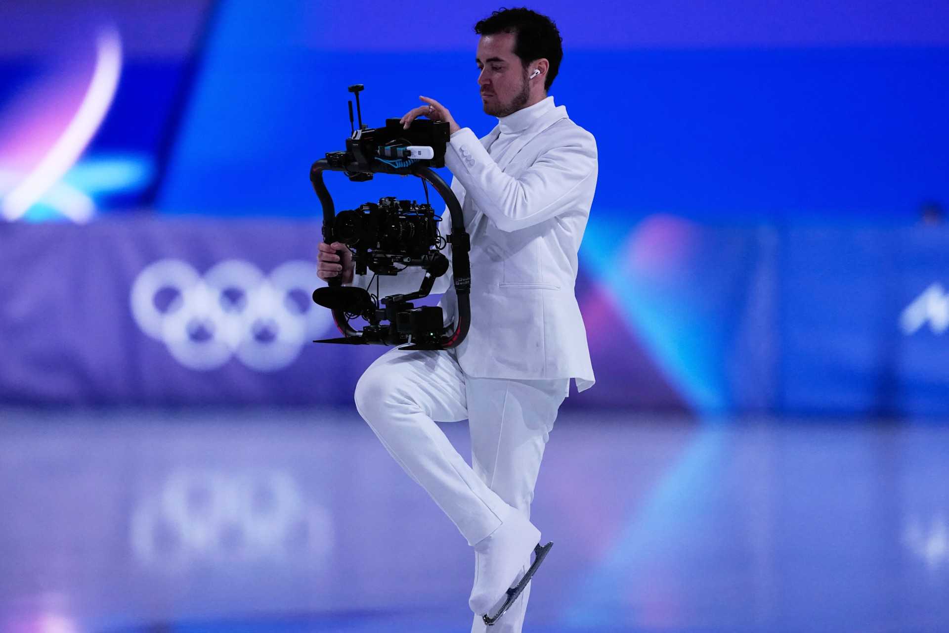 Jordan Cowan operates the steadicam before the pairs figure skating short program at the 2026 Winter Olympics, in Milan, Italy, Sunday, Feb. 15, 2026.