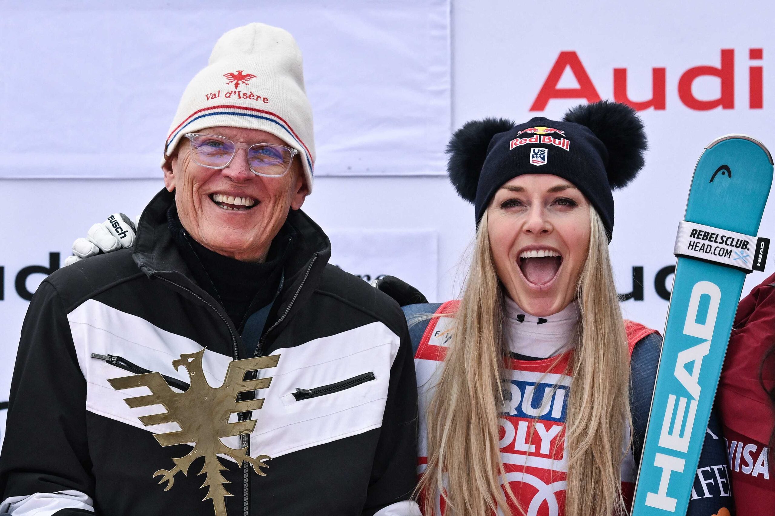 Lindsey Vonn celebrates with her father Alan Kildow and members of her team during the podium ceremony after competing in the women's downhill race part of the FIS Alpine Ski World Cup 2025-2026, on Dec. 20, 2025.