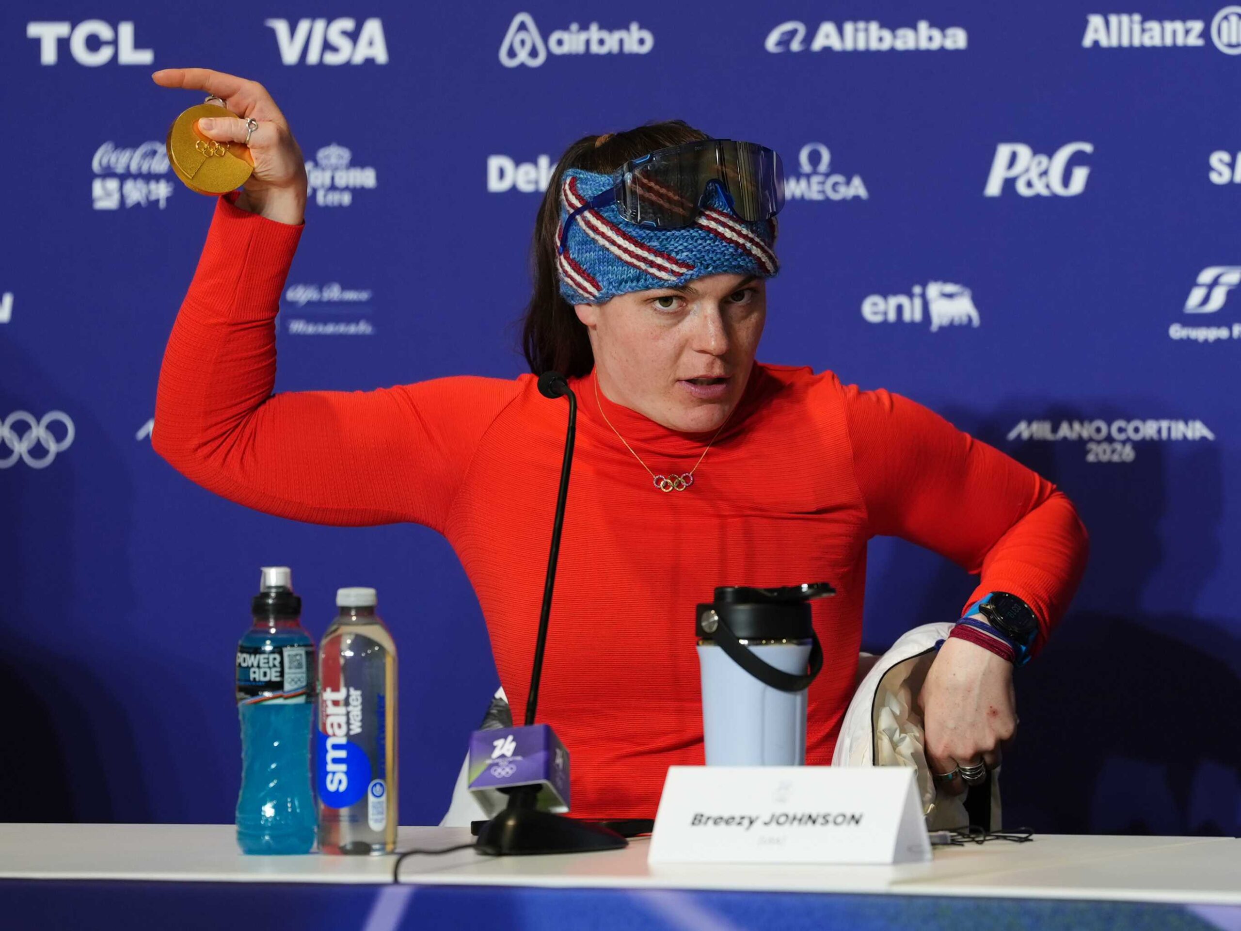 Gold medallist USA&amp;apos;s Breezy Johnson shows her broken medal to the media following the Women&amp;apos;s Alpine Downhill Skiing at the Tofane Alpine Skiing Centre, Cortina d&amp;apos;Ampezzo, on day two of the Milano Cortina 2026 Winter Olympics. Picture date: Sunday February 8, 2026. (Photo by Andrew Milligan/PA Images via Getty Images)