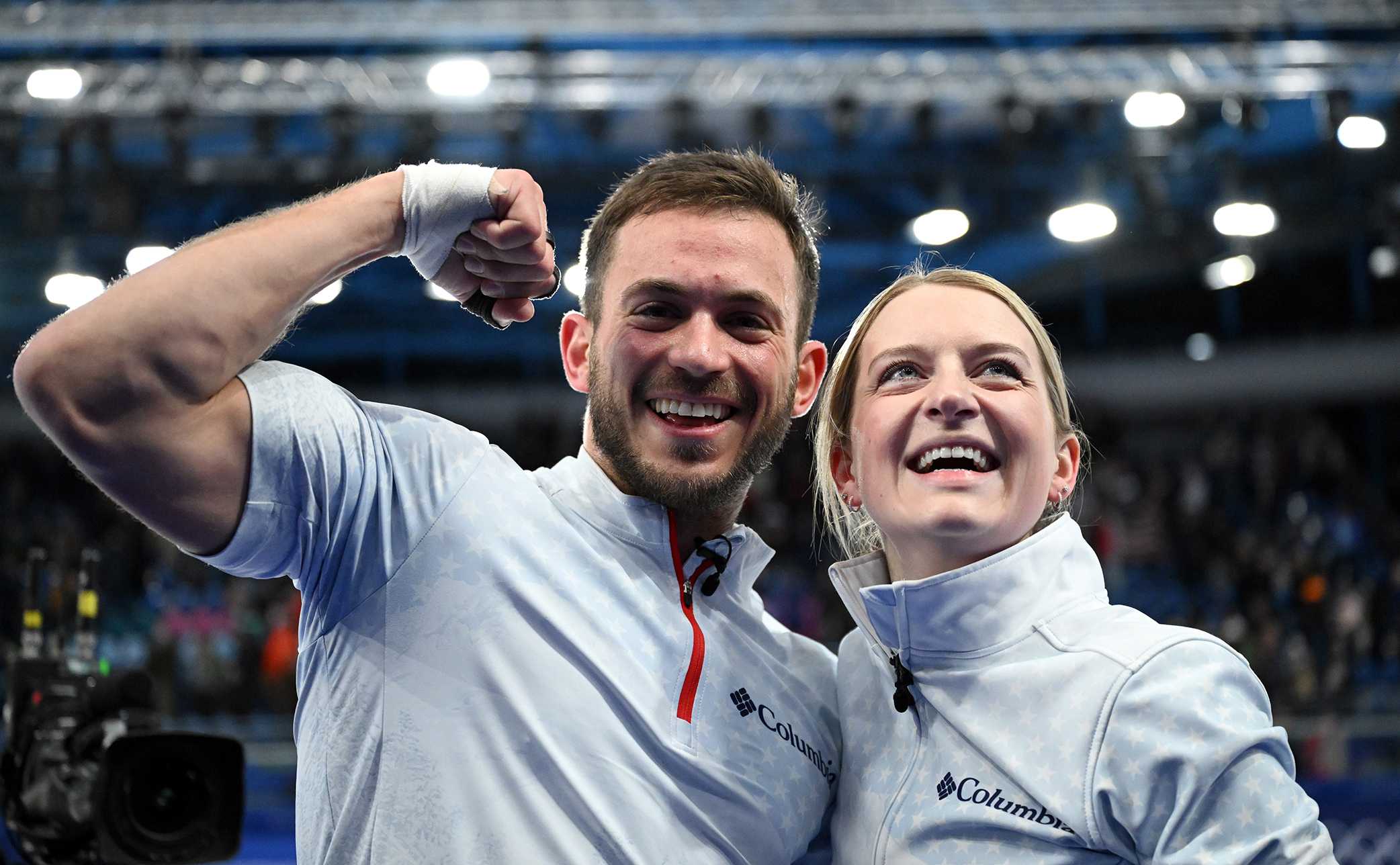 Korey Dropkin and Cory Thiesse of Team United States celebrate after winning the Curling Mixed Doubles semi-finals match between Team Italy and Team United States on day three of the Milano Cortina 2026 Winter Olympic Games at Cortina Curling Olympic Stadium on Feb. 9, 2026, in Cortina d'Ampezzo, Italy.