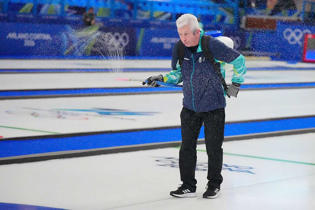 Ice master Mark Callan prepares the playing surface at the Milan Cortina Winter Games.