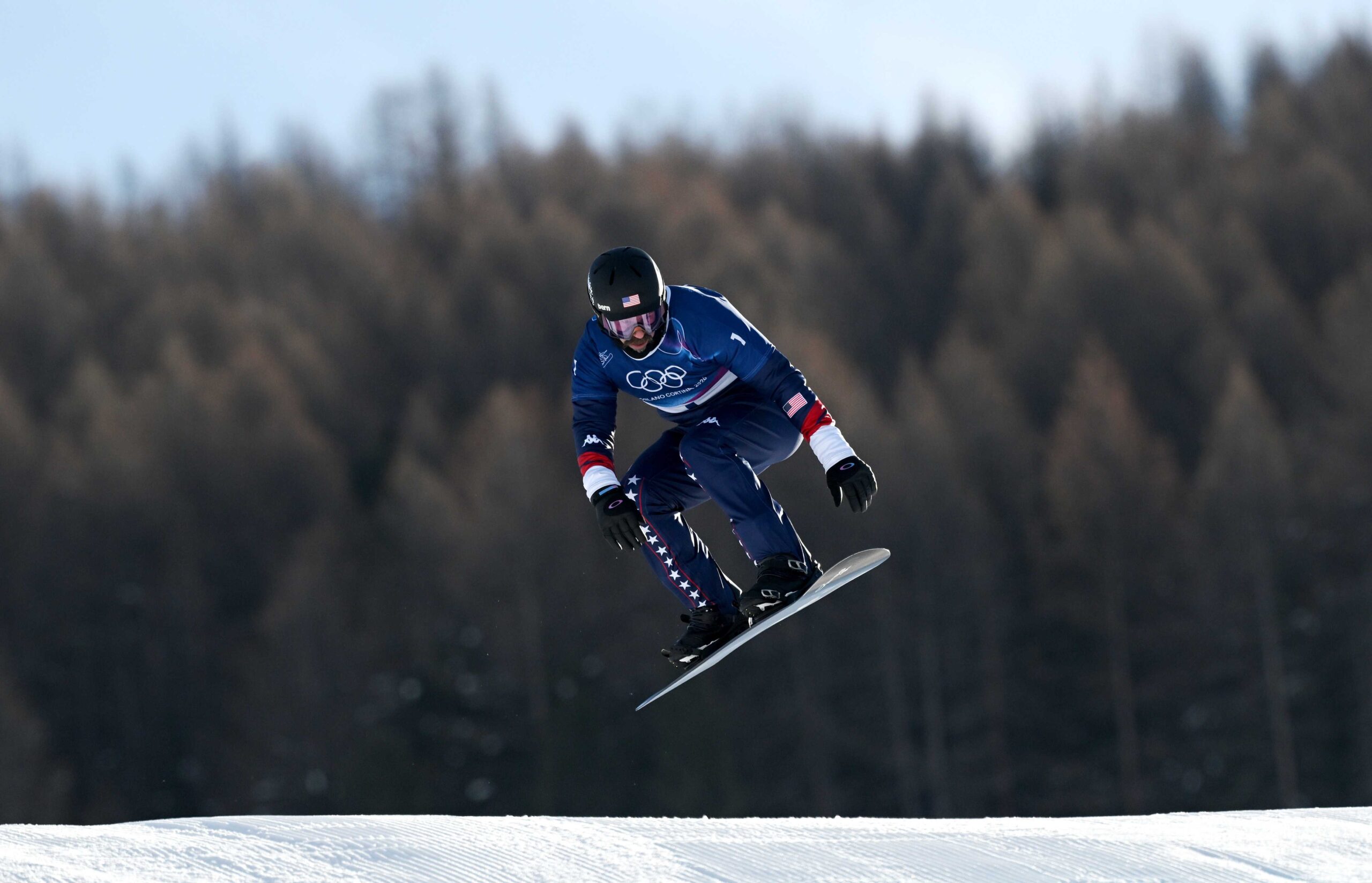Nick Baumgartner of Team United States competes in run one of the Men's Snowboard Cross Seeding on day six of the Milano Cortina 2026 Winter Olympic Games at Livigno Snow Park on Feb. 12, 2026, in Livigno, Italy.