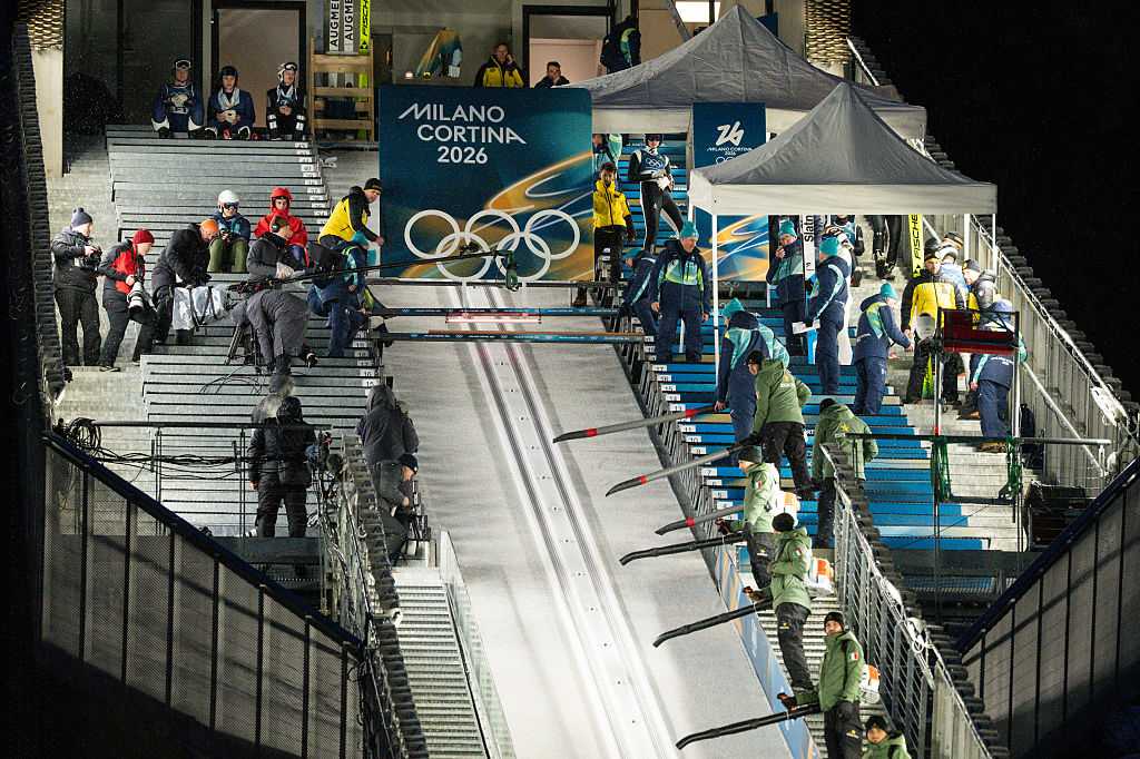 Drying of the inrun tracks during Milano Cortina 2026 Winter Olympics men's large hill individual competition at Predazzo Ski Jumping Stadium in Predazzo on Feb. 14, 2026