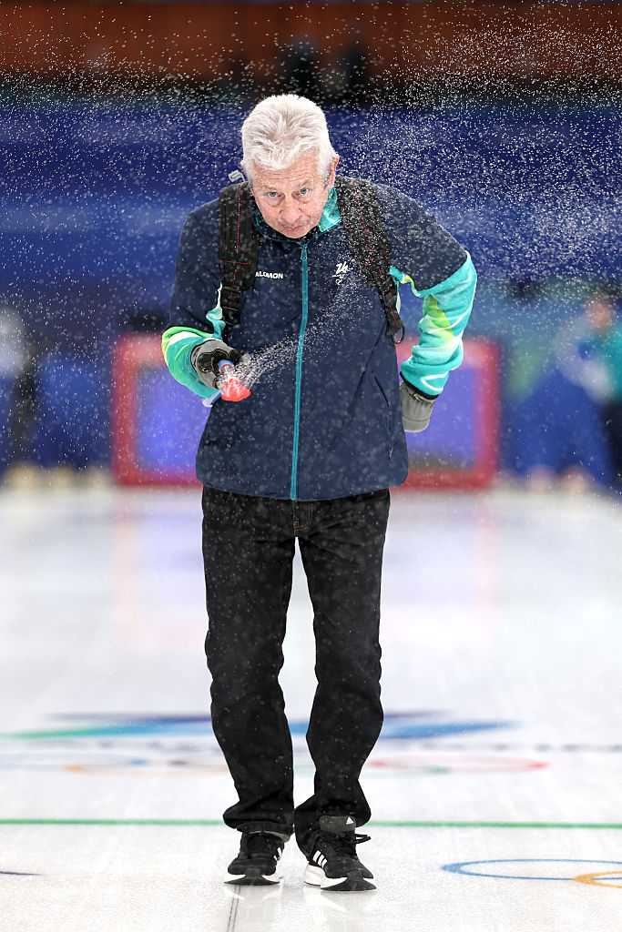 CORTINA D&amp;apos;AMPEZZO, ITALY - FEBRUARY 12: Curling Technician Mark Callan performs his style of pebbling ahead of the Men&amp;apos;s Round Robin matches on day six of the Milano Cortina 2026 Winter Olympic games at Cortina Curling Olympic Stadium on February 12, 2026 in Cortina d&amp;apos;Ampezzo, Italy. (Photo by Al Bello/Getty Images)