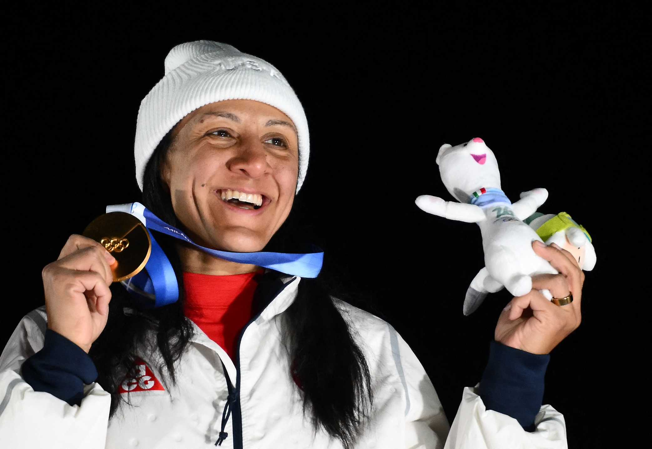 Gold medallist USA's Elana Meyers Taylor smiles on the podium of the bobsleigh women's monobob at Cortina Sliding Centre during the Milano Cortina 2026 Winter Olympic Games in Cortina d'Ampezzo on Feb. 16, 2026.