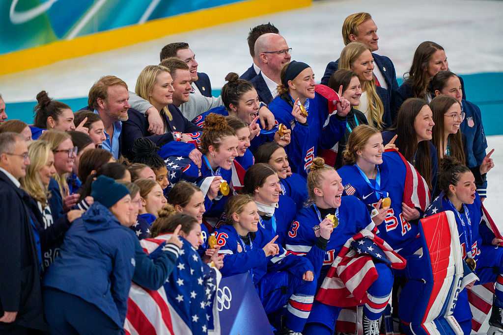 Gold medalists Team United States celebrate the victory after the Women`s Ice Hockey Gold Medal Game between USA and Canada (2-1 OT) on day thirteen of the Milano Cortina 2026 Winter Olympic games at Milano Santagiulia Ice Hockey Arena on February 19, 2026 in Milan, Italy.
