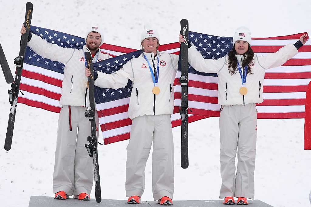 Gold medalists Christopher Lillis of Team United States, Connor Curran of Team United States and Kaila Kuhn of Team United States pose for a photo during the medal ceremony for the Mixed Team Aerials Final on Day 15 of the Milan Cortina 2026 Winter Olympic Games at Livigno Air Park on February 21, 2026, in Livigno, Italy.