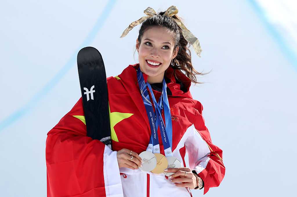 Gold medalist Ailing Eileen Gu of Team People's Republic of China celebrates during the medal ceremony with her collection of medals for the Women's Freeski Halfpipe Final on day sixteen of the Milan Cortina 2026 Winter Olympic Games at Livigno Air Park on Feb. 22, 2026, in Livigno, Italy.