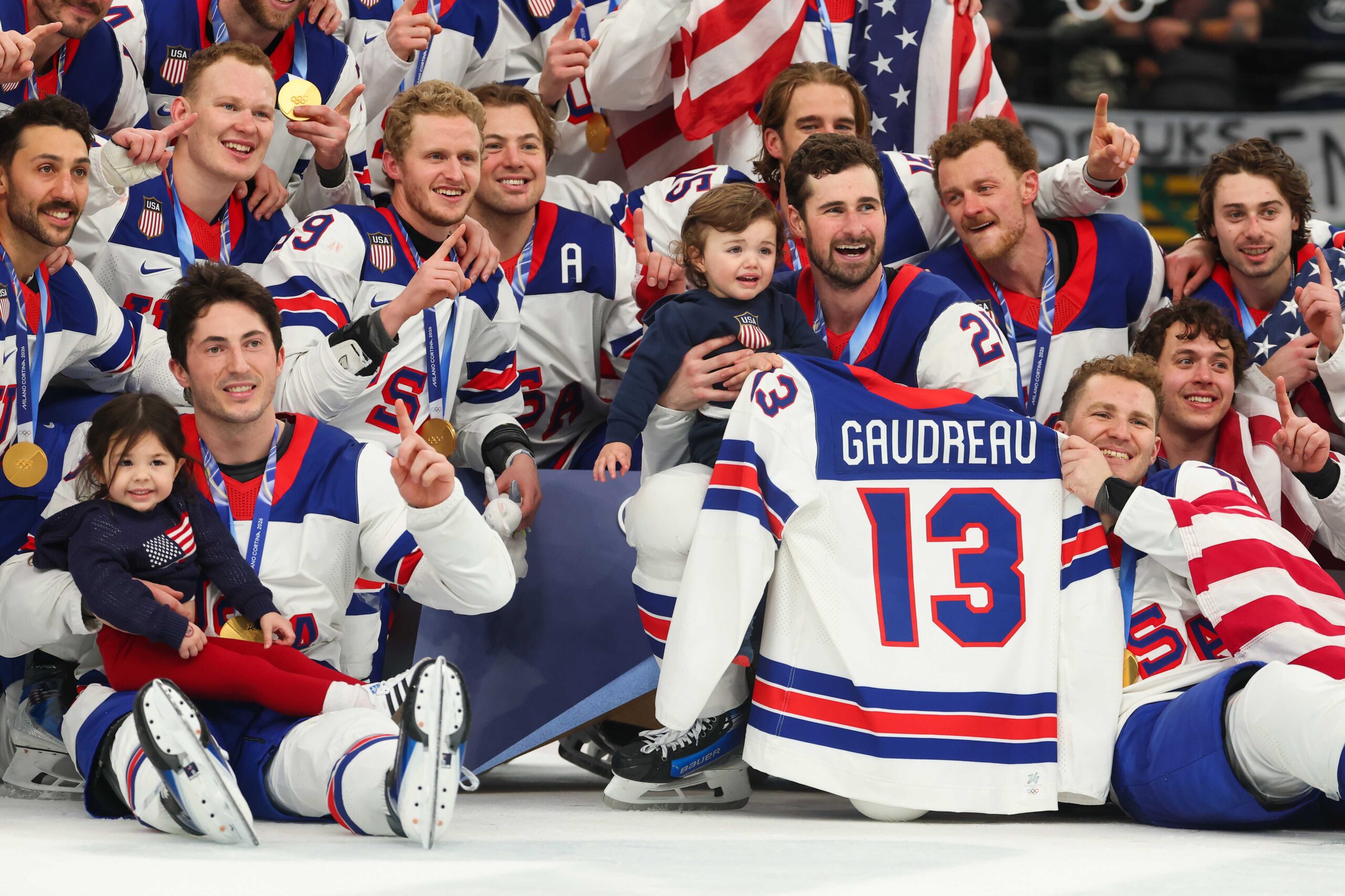 Players of Team United States pose for photographs during the medal ceremony following the Men's Gold Medal match between Canada and the United States on day 16 of the Milan Cortina 2026 Winter Olympic games at Milano Santagiulia Ice Hockey Arena on February 22, 2026, in Milan, Italy.
