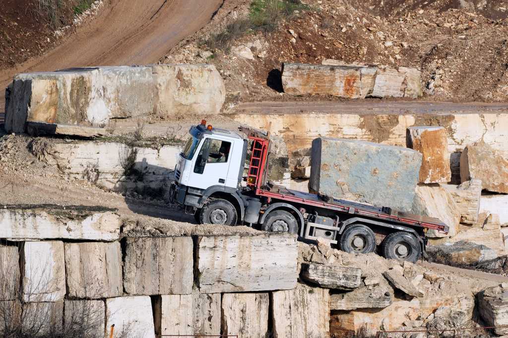 A truck carries a block of travertine at the Degemar Quarry near Tivoli, Italy, 35 kilometers east of Rome, on Friday, Feb. 13, 2026, where 17th-century Baroque architect Gian Lorenzo Bernini selected travertine for the colonnade of St. Peter&amp;apos;s Square.