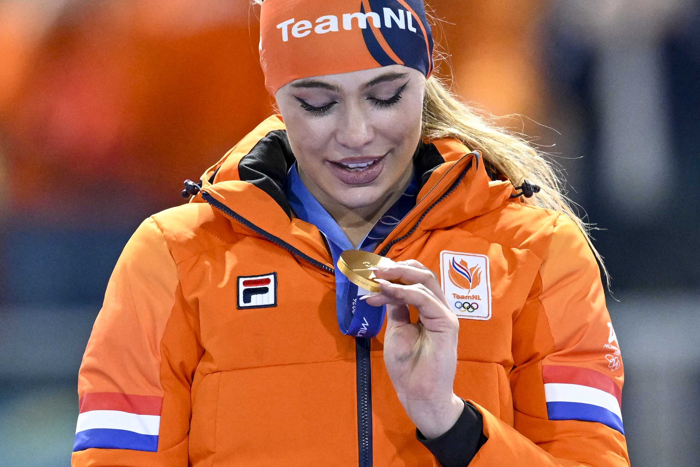 Gold medalist Jutta Leerdam poses on the podium at the end of the speed skating women's 1000m during the Milano Cortina 2026 Winter Olympic Games at Milano Speed Skating Stadium in Milan on Feb. 9, 2026.