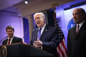 President Donald Trump speaks during a press briefing at the White House Feb. 20, 2026 in Washington, D.C., after the U.S. Supreme Court ruled against his use of emergency powers to implement international trade tariffs. Also pictured on stage, left to right, are Solicitor General John Sauer and Secretary of Commerce Howard Lutnick. (Photo by Kevin Dietsch/Getty Images)