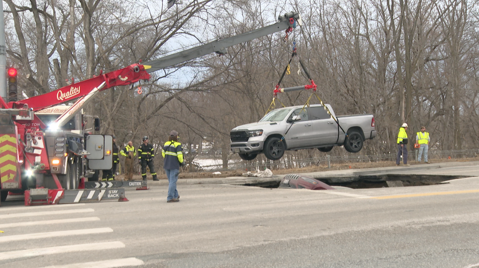 Truck lifted from sinkhole