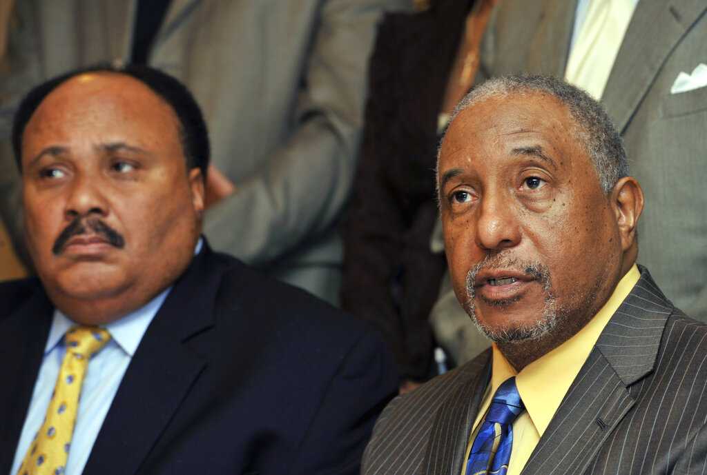 FILE - In this March 6, 2010, file photo, Southern Christian Leadership Conference spokesman Bernard LaFayette, right, speaks to reporters as Martin Luther King III, left, looks on in Atlanta. LaFayette attended nonviolence workshops led by Rev. James Lawson during the civil rights struggles of the 1960s. (AP Photo/Gregory Smith)