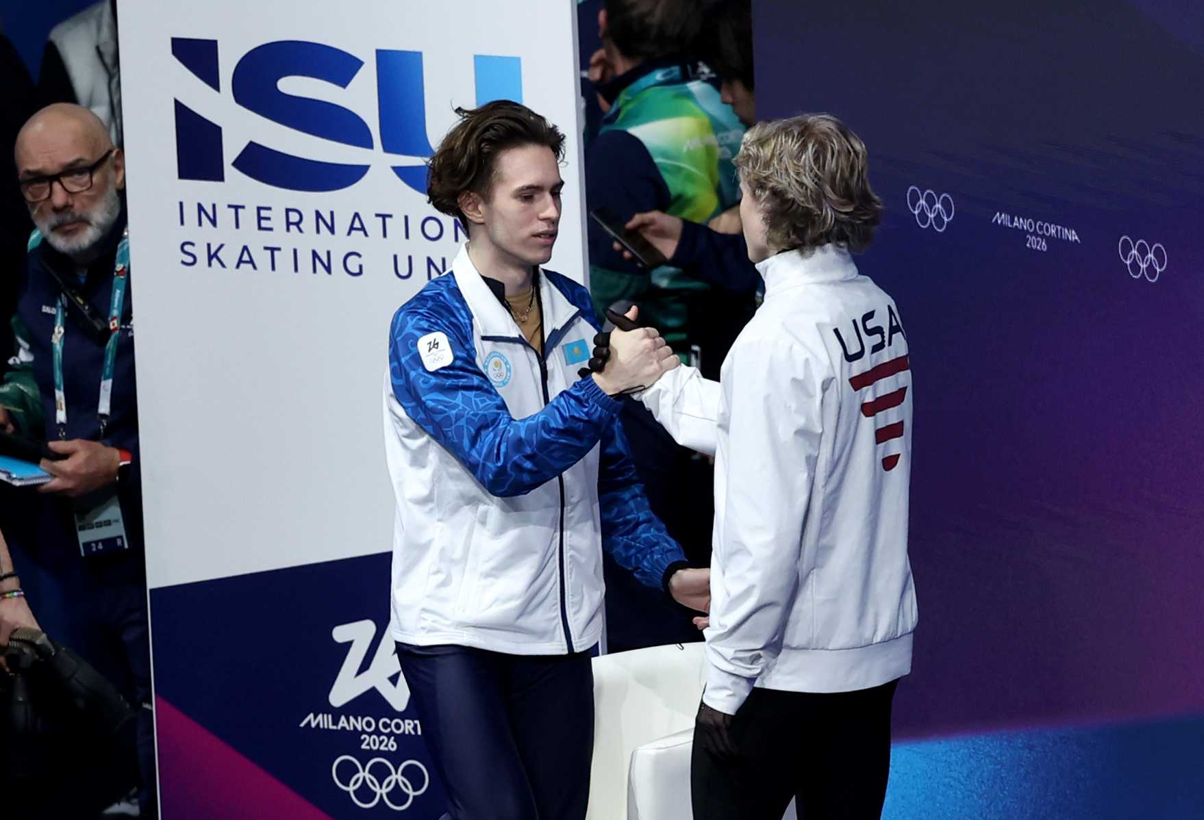 Kazakhstan's Mikhail Shaidorov (left) is congratulated by USA's Ilia Malinin after winning the Gold medal during the free skating men's single skating event at Milano Ice Skating Arena, on day seven of the Milano Cortina 2026 Winter Olympics, Italy.