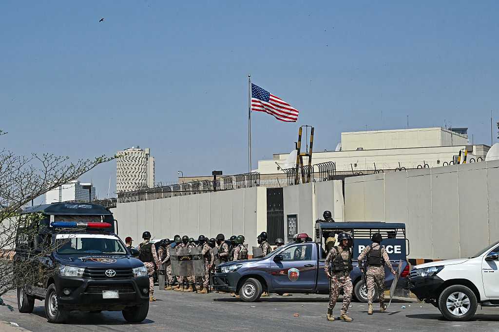 Security personnel stand guard outside the US consulate in Karachi on March 1, 2026 during a clash with Shiite Muslims as they attempt to storm the premises after the death of Iran's supreme leader Ayatollah Ali Khamenei amid US-Israel strikes.