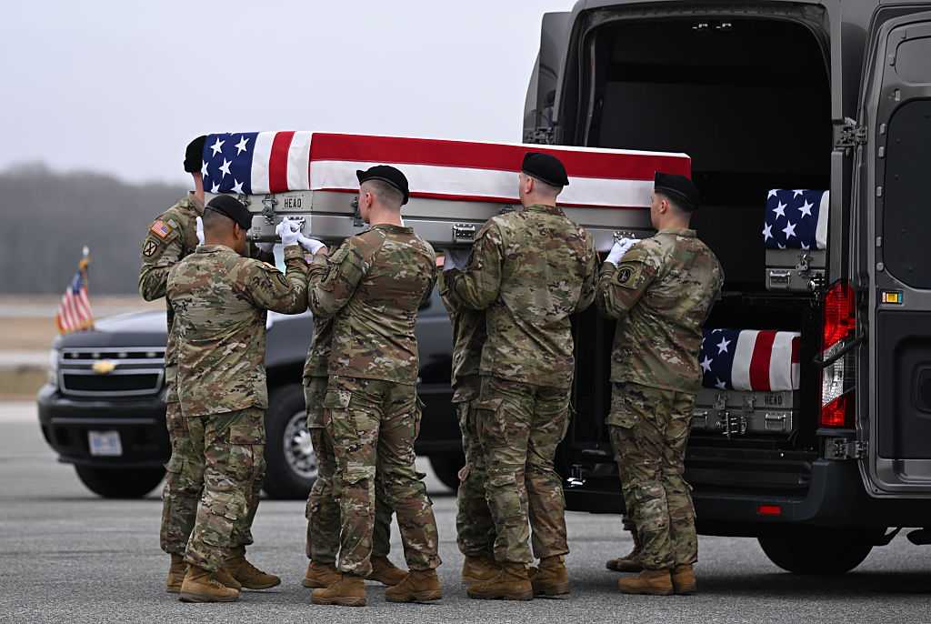 DOVER, DELAWARE - MARCH 07: A U.S. Army carry team transports a flagged-draped transfer case to a vehicle during a dignified transfer at Dover Air Force Base March 07, 2026 in Dover, Delaware.  Six soldiers from the 103rd Sustainment Command were killed in action by an Iranian drone strike on March 1 in Port Shuabia, Kuwait during &amp;quot;Operation Epic Fury&amp;quot;. (Photo by Roberto Schmidt/Getty Images)