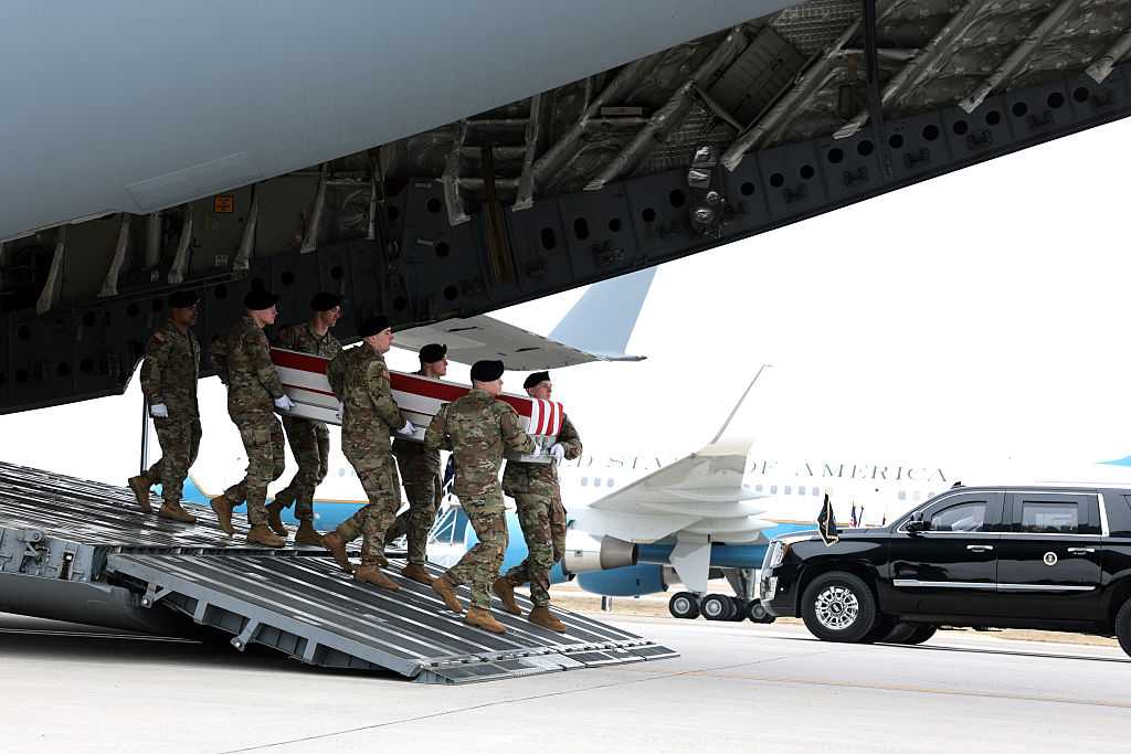 DOVER, DELAWARE - MARCH 07: A U.S. Army carry team moves a flagged-draped transfer case containing the remains of Maj. gt. Declan J. Coady at Dover Air Force Base March 07, 2026 in Dover, Delaware.  Six soldiers from the 103rd Sustainment Command were killed in action by an Iranian drone strike on March 1 in Port Shuabia, Kuwait during &amp;quot;Operation Epic Fury&amp;quot;. (Photo by Anna Moneymaker/Getty Images)