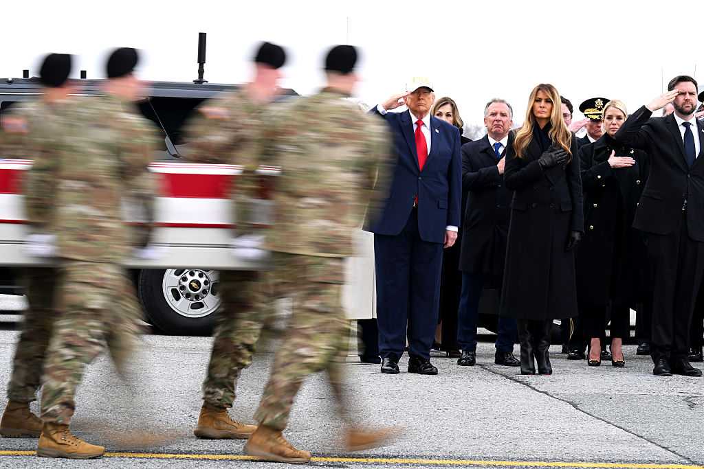 DOVER, DELAWARE - MARCH 07: (L-R) U.S. President Donald Trump, U.S. Special Envoy to the Middle East Steve Witkoff, first lady Melania Trump,  U.S. Attorney General Pam Bondi and Vice President JD Vance stand at attention as a U.S. Army carry team moves a flagged-draped transfer case at Dover Air Force Base March 07, 2026 in Dover, Delaware.  Six soldiers from the 103rd Sustainment Command were killed in action by an Iranian drone strike on March 1 in Port Shuabia, Kuwait during &amp;quot;Operation Epic Fury&amp;quot;. (Photo by Roberto Schmidt/Getty Images)