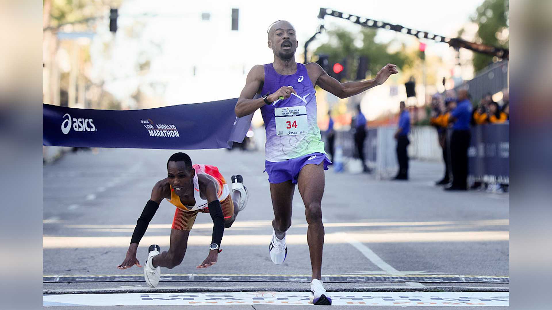 United States Nathan Martin crosses the finish line to place first with a time of 2:11:16.50 on a last-second sprint as Kenya's Michael Kimani Kamau dives and falls to the pavement during the 2026 ASICS Los Angeles Marathon in Los Angeles Sunday, March 8, 2026.
