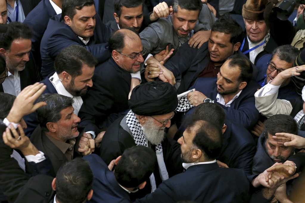 FILE - Iran&amp;apos;s supreme leader Ayatollah Ali Khamenei, center, leaves an event titled &amp;quot;International Conference in Support of Palestinian Intifada,&amp;quot; in Tehran, Iran, Feb. 21, 2017.
