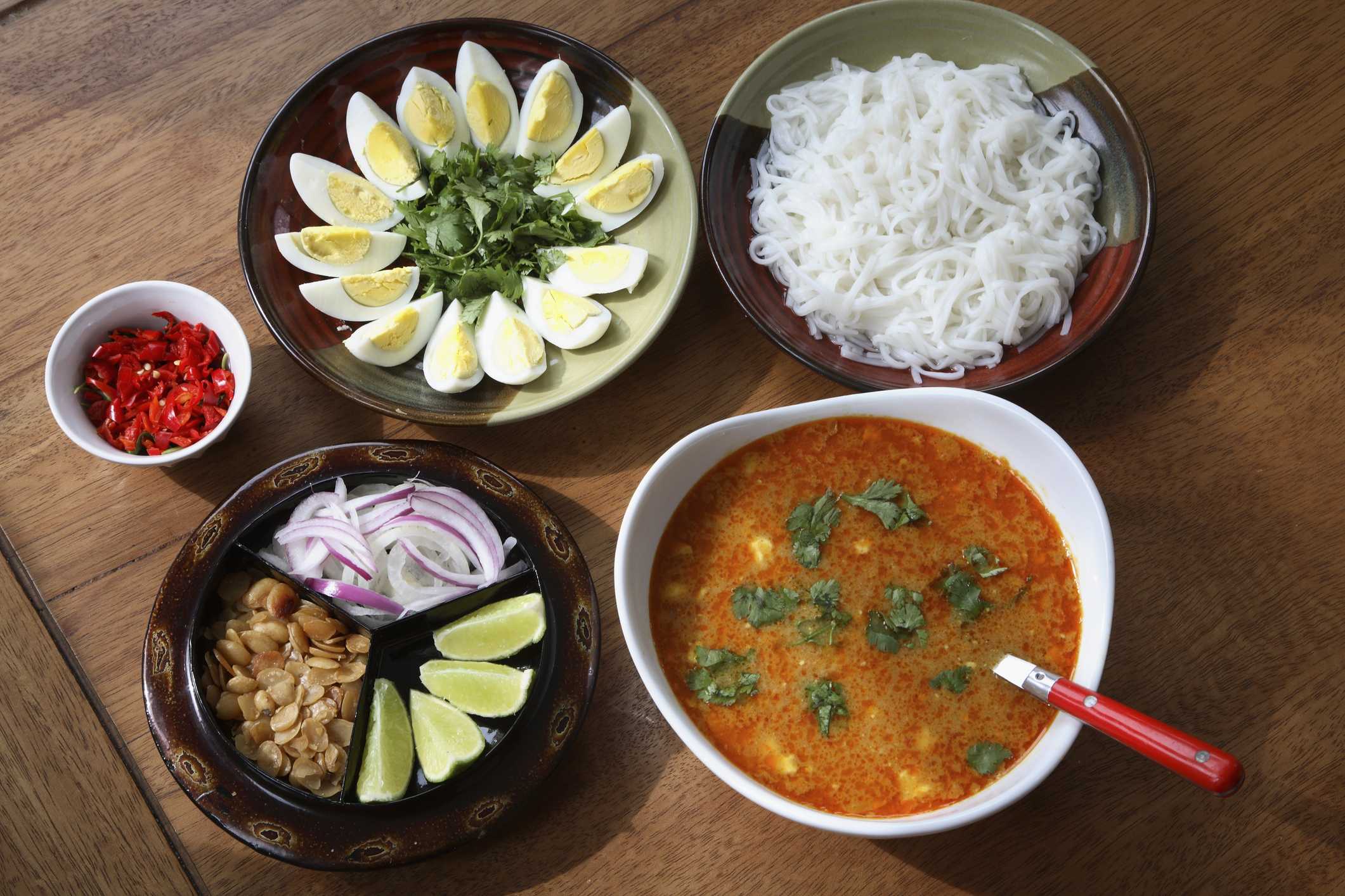 Myanmar, Burmese Mohinga fish soup with side dishes