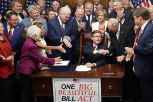 U.S. Speaker of the House Rep. Mike Johnson (R-LA) celebrates with fellow House Republicans during an enrollment ceremony of H.R. 1, the One, Big, Beautiful Bill Act at the U.S. Capitol on July 3, 2025 in Washington, DC. The House passed the sweeping tax and spending bill after winning over fiscal hawks and moderate Republicans. The bill makes permanent President Donald Trump&rsquo;s 2017 tax cuts, increase spending on defense and immigration enforcement and temporarily cut taxes on tips, while at the same time c