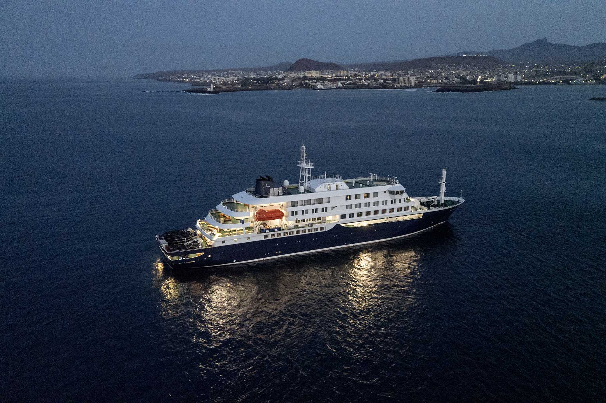 A general view of the cruise ship MV Hondius, while stationary off the port of Praia, the capital of Cape Verde, on May 6, 2026. Two seriously ill crew members on a cruise ship stricken by a deadly hantavirus outbreak will be evacuated via Cape Verde to the Netherlands, allowing the vessel to sail on to Spain's Canary Islands, the ship operator said on May 5, 2026.&amp;#xA;The MV Hondius has been at the centre of an international health scare since Saturday, when WHO was informed that the rare disease -- usually spread from infected rodents typically through urine, droppings and saliva -- was suspected of being behind the deaths of three of its passengers.&amp;#xA;As others fell ill, passengers and crew have been in isolation after Cape Verde authorities barred the ship from docking, and as health authorities scrambled to find a port that would take the Hondius. (Photo by AFP via Getty Images)