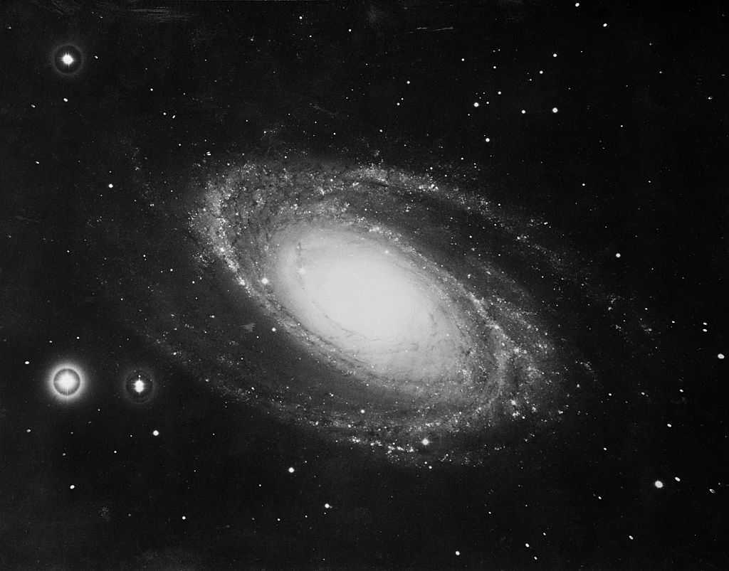 (Original Caption) Spiral nebula Messier-81, located near the Big Dipper in the constellation of Ursa Major (The Great Bear), is pictured as she looked through the new 200-inch Hale telescope on Palomar Mountain. It&amp;apos;s distance, as determined by astronomer Allan R. Sandage of Mount Wilson and Palomar Observatory, is about 7,000 light years. The distance is four times as great as that obtained for it in 1936. M-81 is a vast aggregation of stars whirling in space and resembles our own galaxy, the Milky Way, in form and structure. In earthly units of distance, M-81 is about 42 quintillion miles from us.