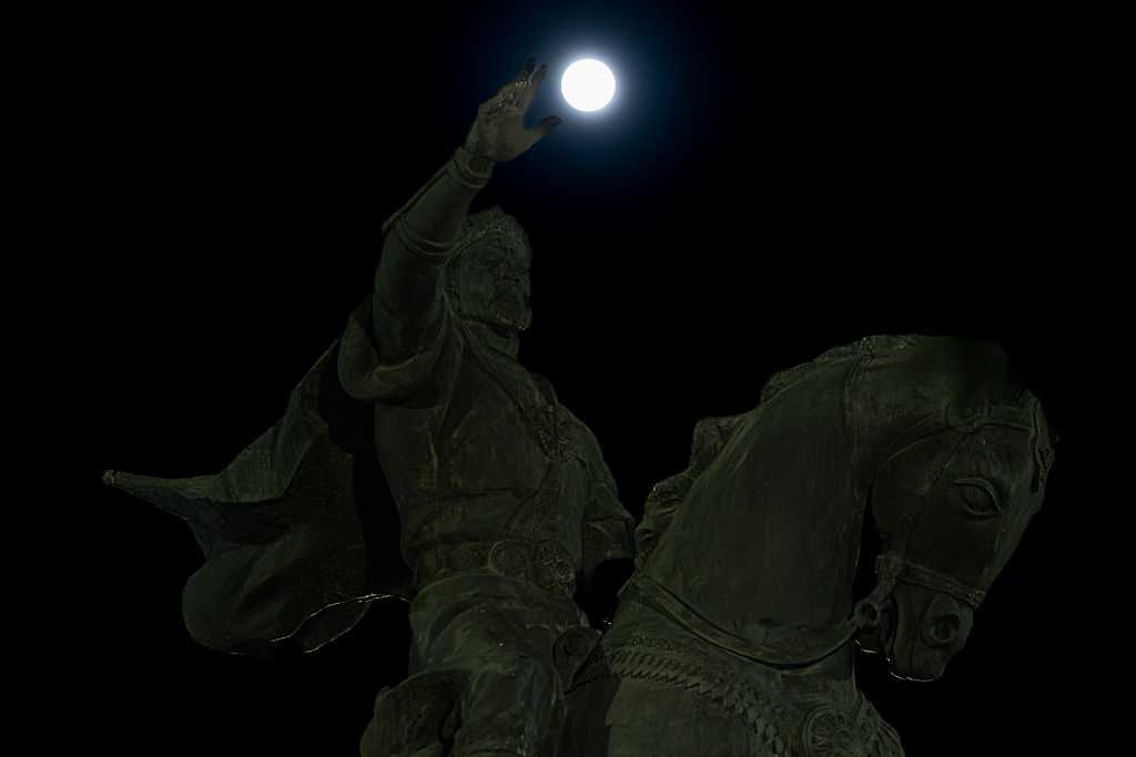TASHKENT, UZBEKISTAN - MAY 13: The Full Moon known as Full Flower Moon rises over the sky creating a striking scene with the statue of Emir Timur in Tashkent, Uzbekistan on May 13, 2025. (Photo by Yasin Baturhan Ergin/Anadolu via Getty Images)