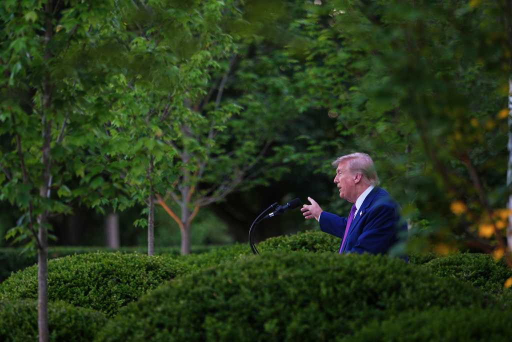 President Donald Trump speaks at a dinner for members of his administration and law enforcement organization leaders, during National Police Week, in the White House Rose Garden, Monday, May 11, 2026, in Washington.