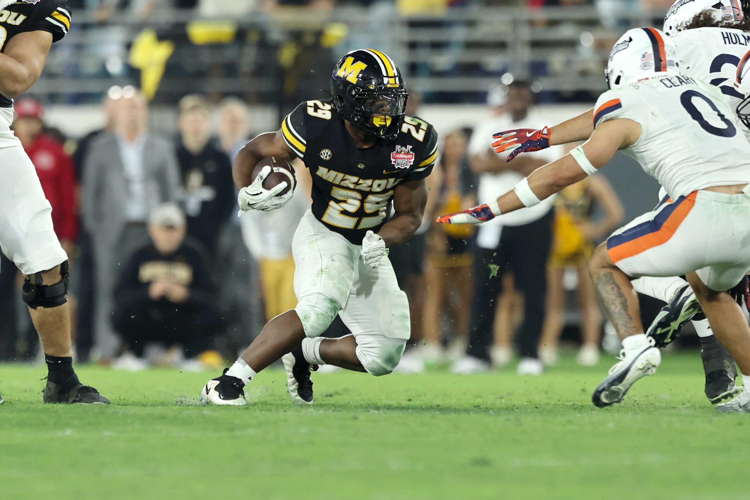 JACKSONVILLE, FLORIDA -  Ahmad Hardy #29 of the Missouri Tigers runs the ball during the 2025 TaxSlayer Gator Bowl between the Missouri Tigers and Virginia Cavaliers at EverBank Stadium on December 27, 2025 in Jacksonville, Florida. (Photo by Dustin Markland/Getty Images)