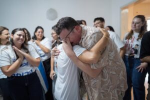 Relatives and friends of hostage Guy Gilboa-Dalal embrace as they learn the news of his release on Oct. 13, 2025, in Ra'anana, Israel. The ceasefire deal between Israel and Hamas has brought an end to the two years of war that followed the attacks of Oct. 7, 2023. A condition of the deal was the immediate return of hostages held in Gaza. (Photo by Dima Vazinovich/Getty Images)